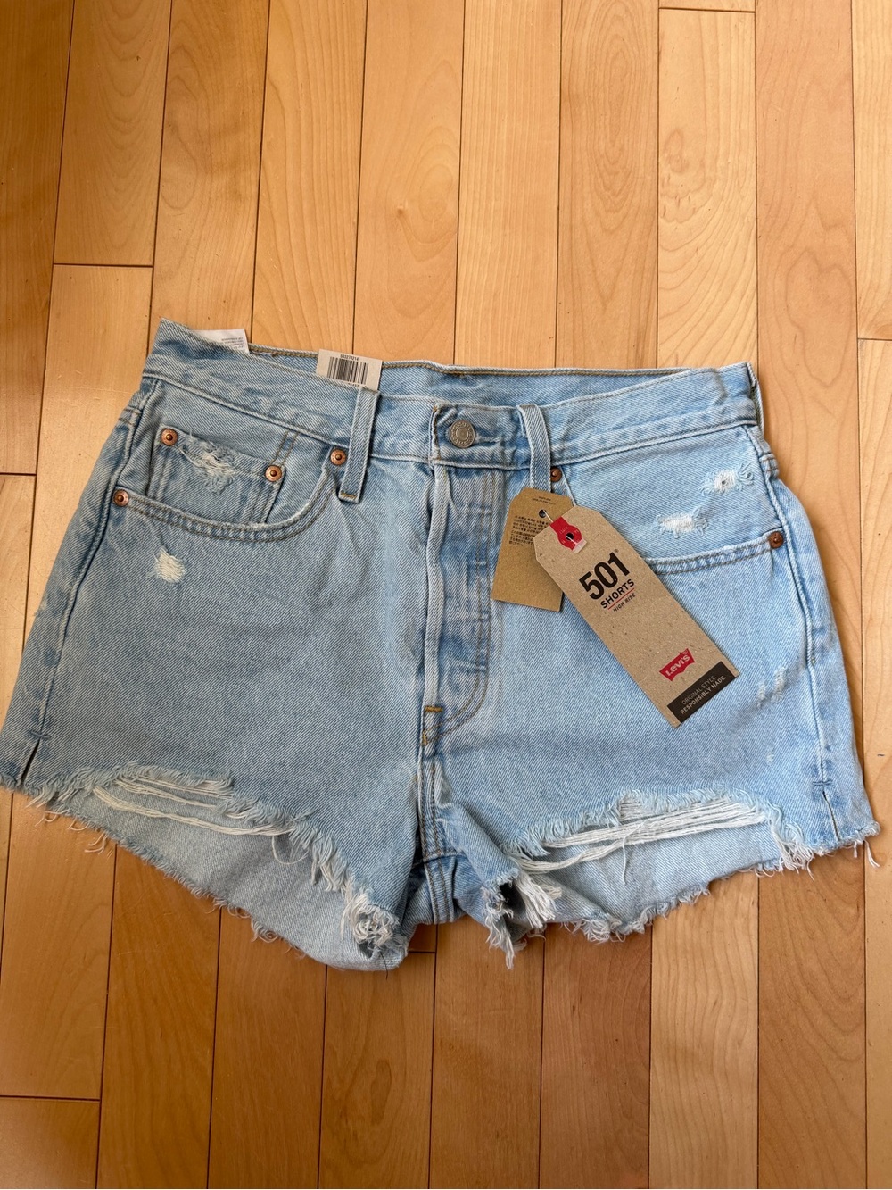 Levi’s 501 high rise shorts size 28, new with tags. In a light wash.